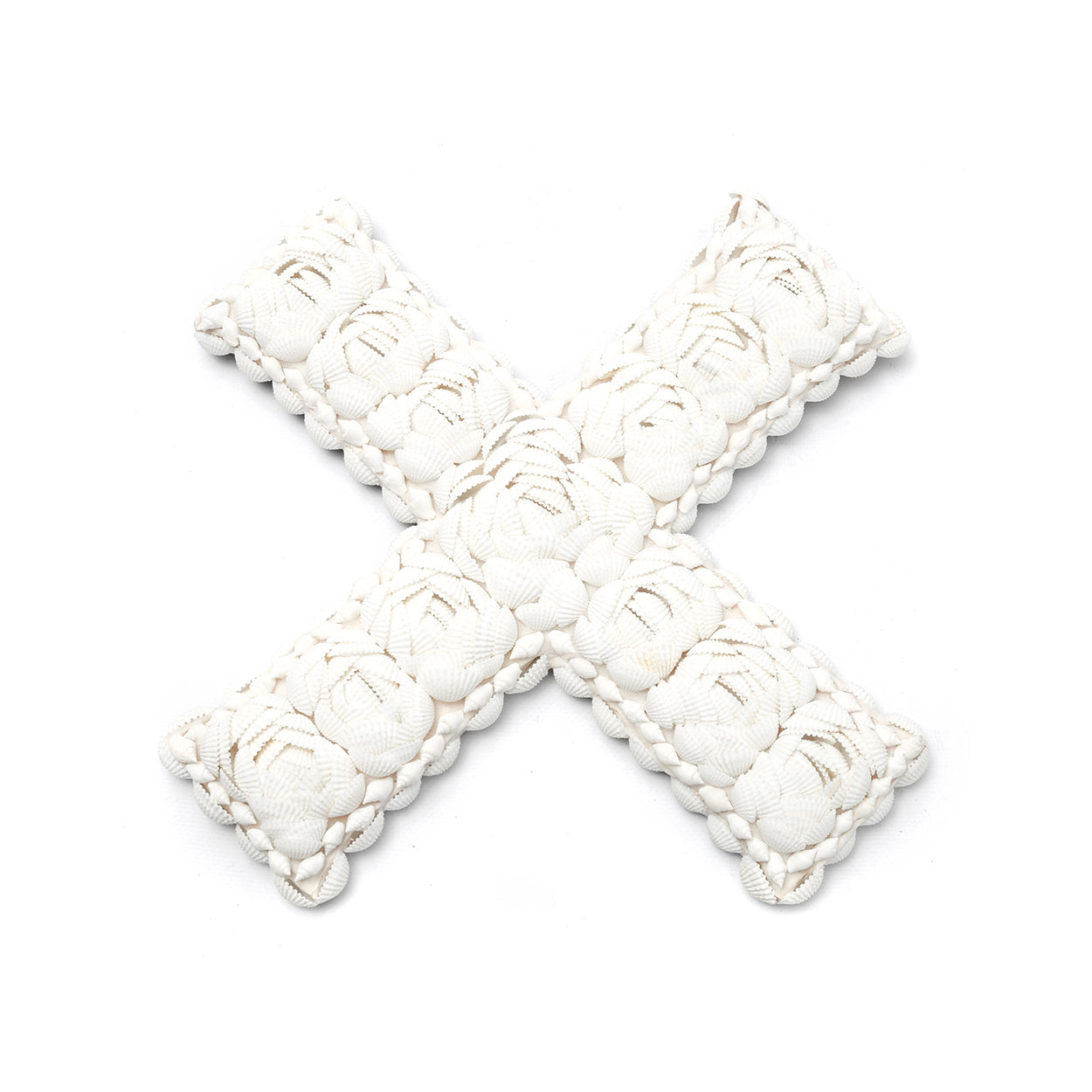 The Shell X White L — natural shell wall decor in cross form on white background, top-down view showing the overlapping shell texture