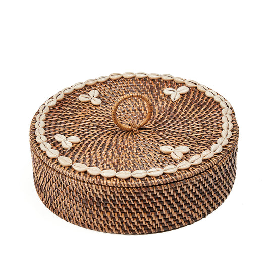 Top-down view of the Rattan Compartment Basket lid showing the full cowrie shell ring and woven loop handle