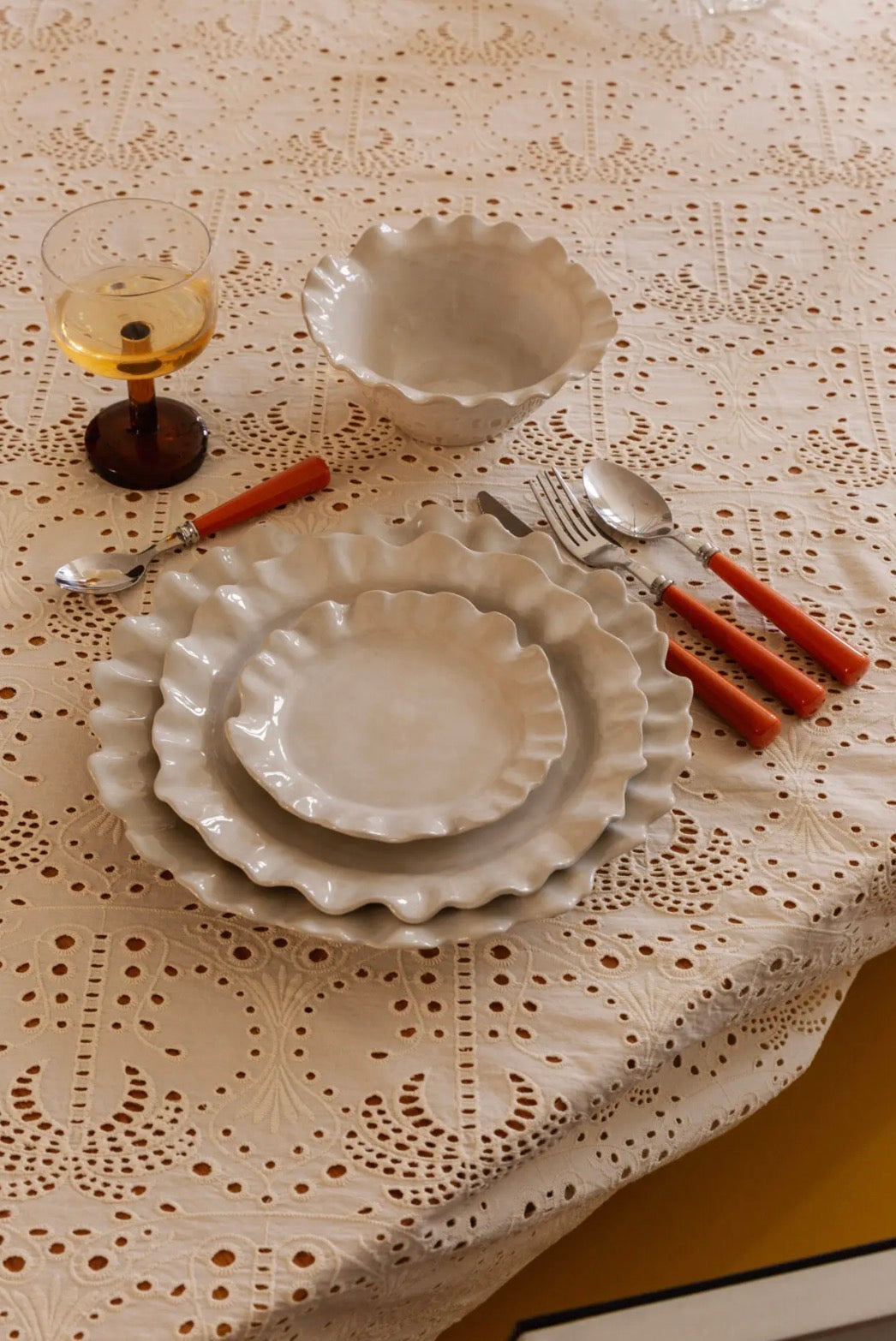 Valerie Dinner Plate White — styled table setting with linen tablecloth, amber wine glass and terracotta-handled cutlery