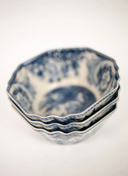 Estelle Bowl Blue — three stacked octagonal stoneware bowls with blue toile pattern, side view on white background