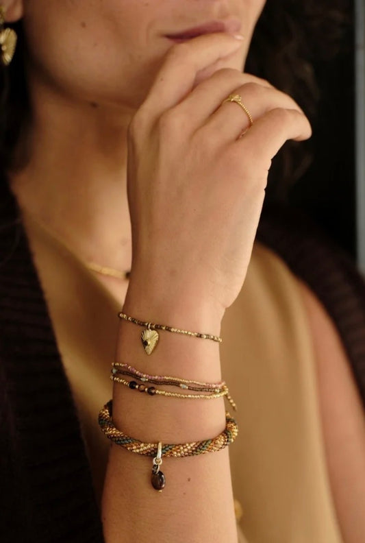 Balanced Tiger Eye Bracelet – Model wearing stacked bracelets