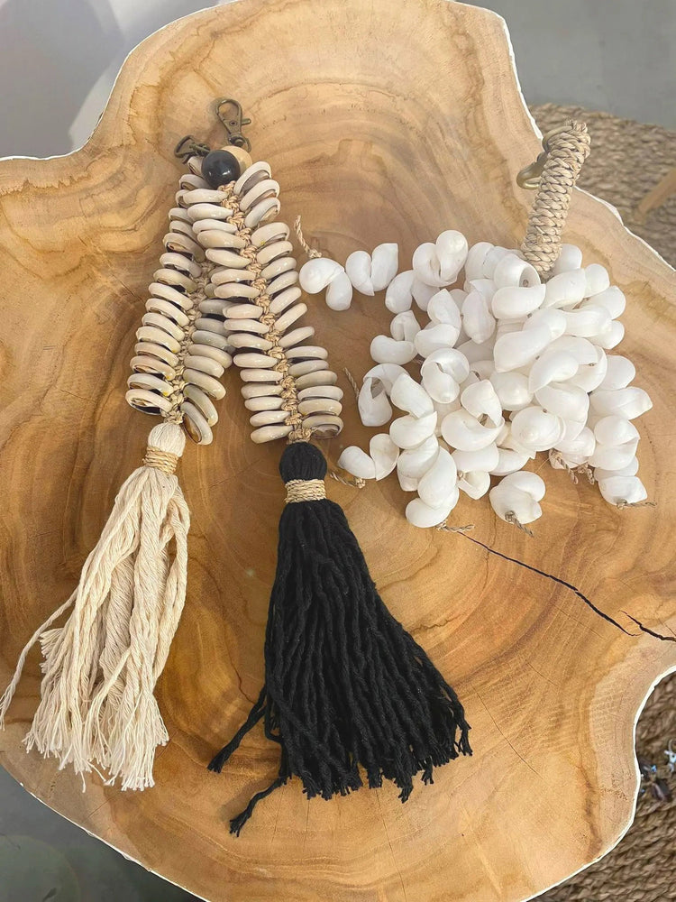 The Kai Shell Keychain — White, front view brass clasp white background