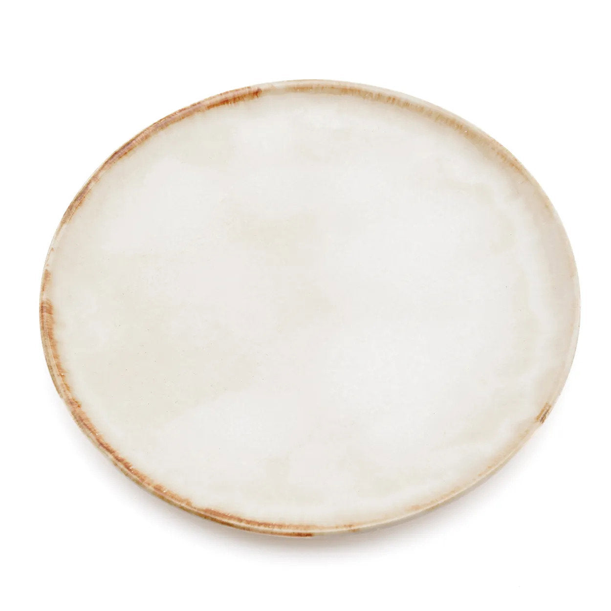 The Cascais Dinner Plate in creamy white stoneware with burnt-umber rim, top-down view on white background