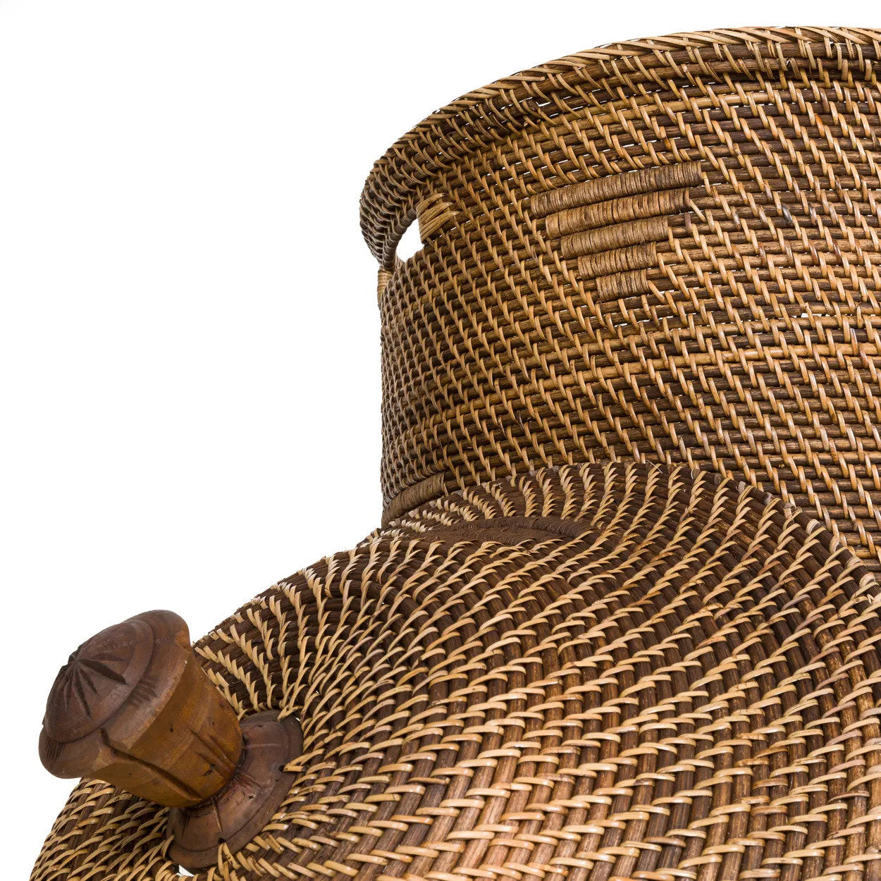 The Colonial Laundry Basket XL in natural brown rattan beside a pool with linen curtains