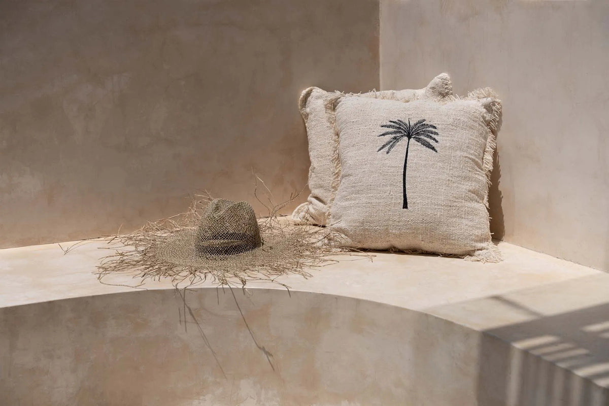 The Gili Palm Cushion Cover Natural/Black — full front view, embroidered palm on natural cotton with fringe border