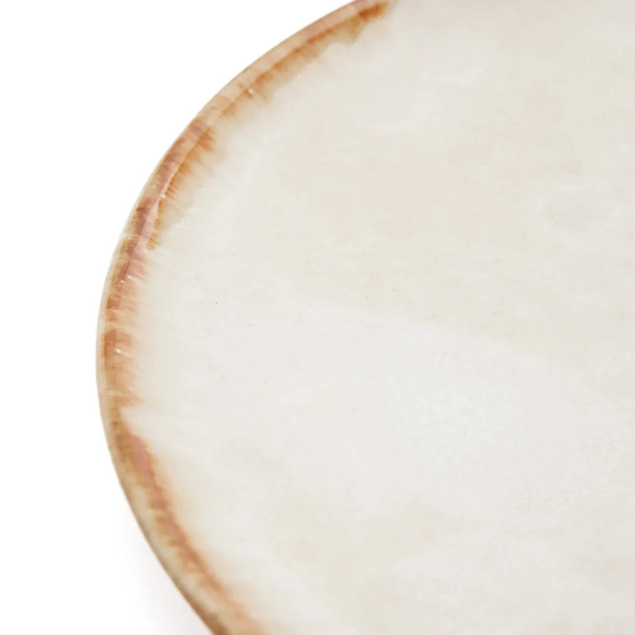 The Cascais Dinner Plate side profile showing the low form and hand-applied burnt-umber rim detail