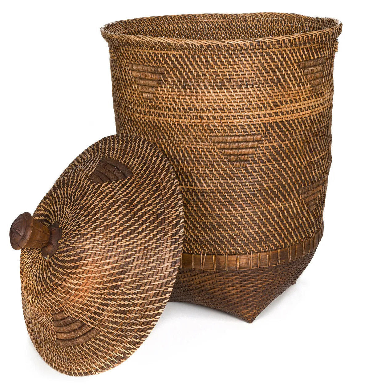 The Colonial Laundry Basket XL styled in a warm interior beside a terracotta plant pot