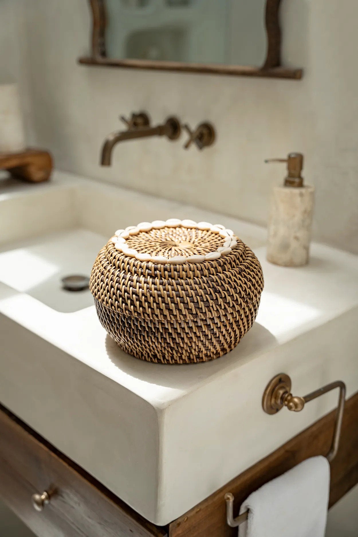 The Colonial Peek-a-Boo Basket S styled on a bathroom counter beside a marble soap dispenser