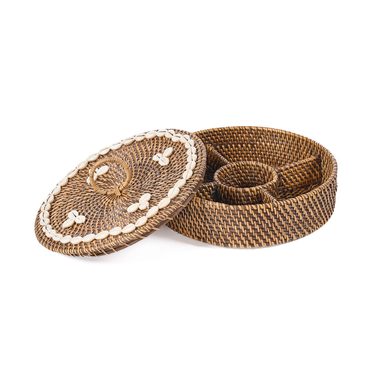 Close-up of the Rattan Compartment Basket lid showing the cowrie shell ring and woven loop handle detail
