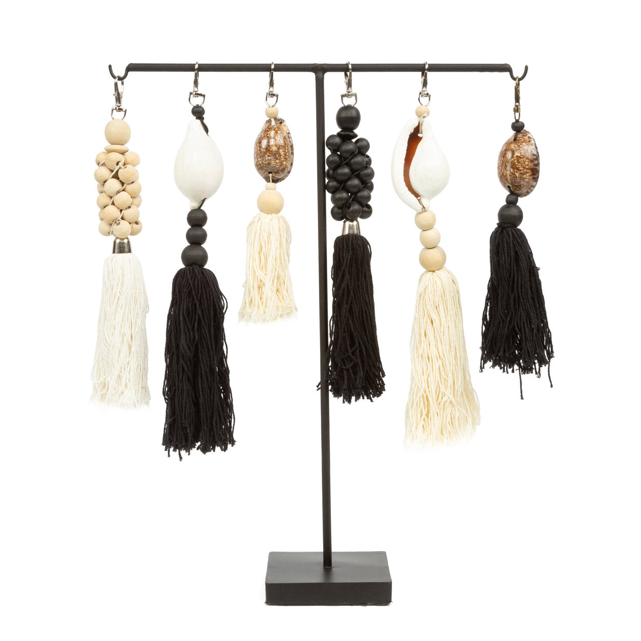 The Togian Keychain — Black White, close-up of shell and beads white background