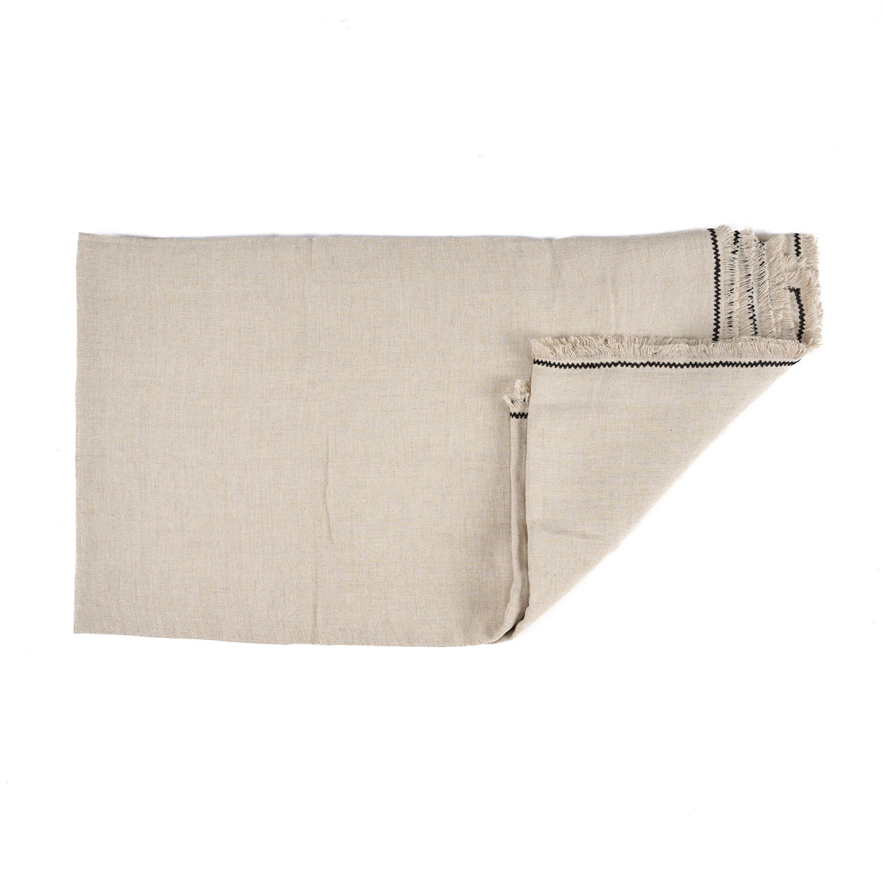 The Tuscany Tablecloth — Natural Black 150×300, lifestyle on table angled view