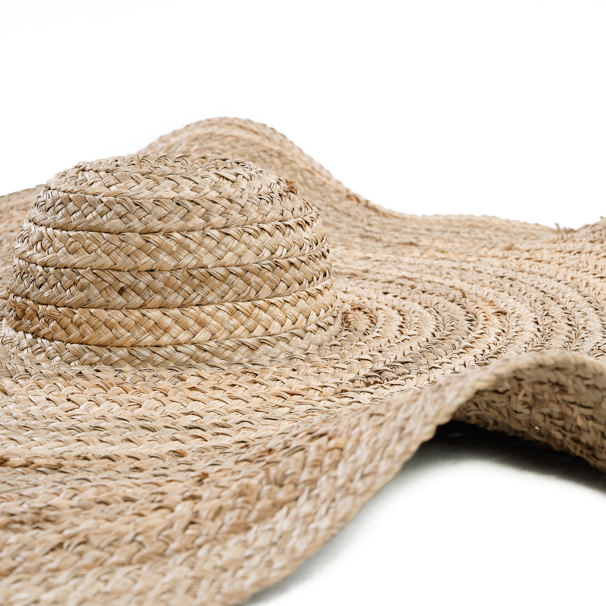 The Lolita Hat — Natural, close-up of crown and wave brim white background