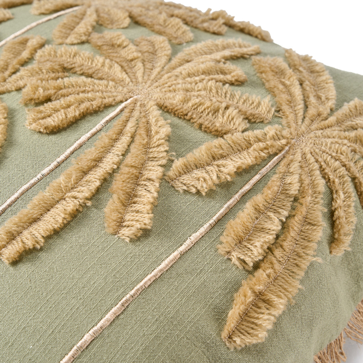 The Tropical Breeze Cushion Cover — lifestyle shot on teak chair, wider view with terracotta vase