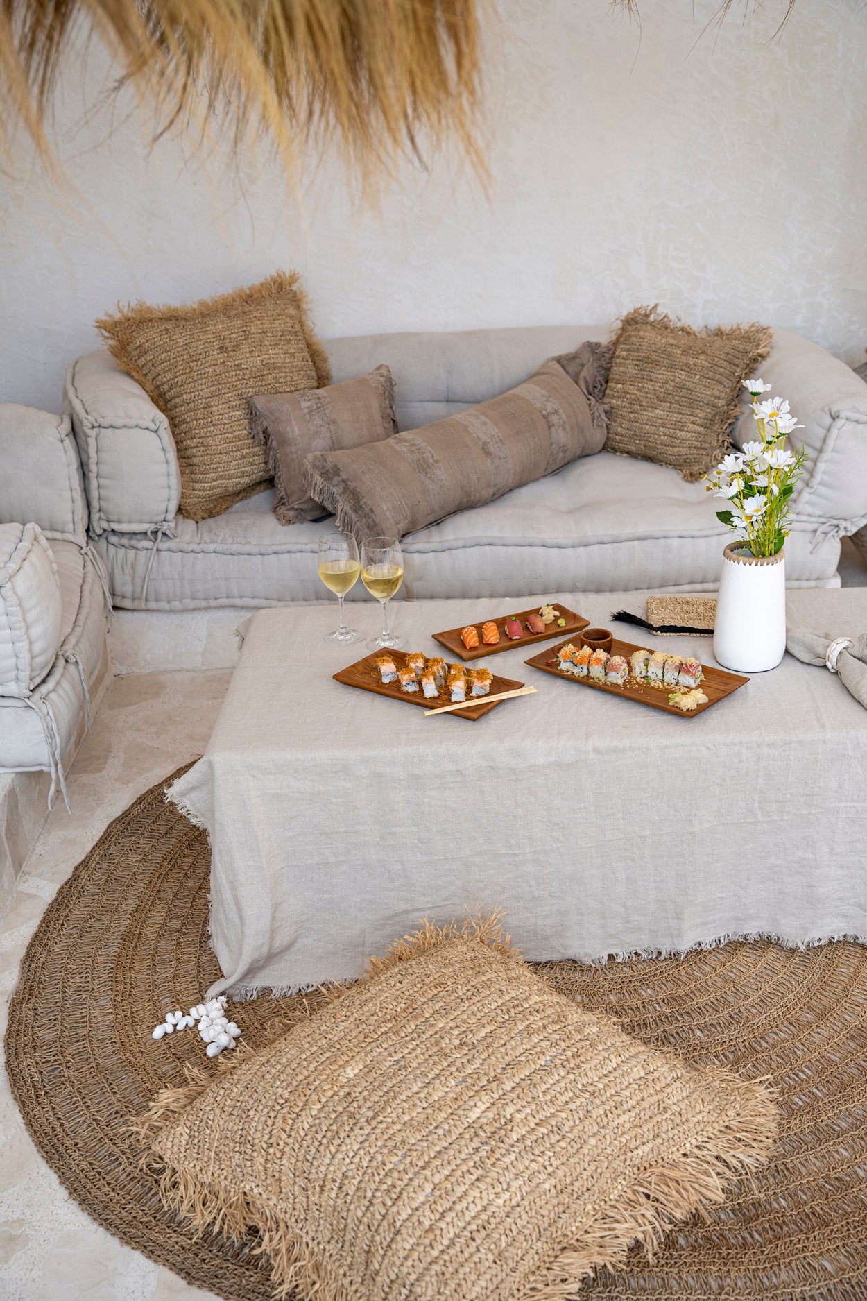 The Linen Tablecloth — Beige 150×150, lifestyle Mediterranean terrace wide shot