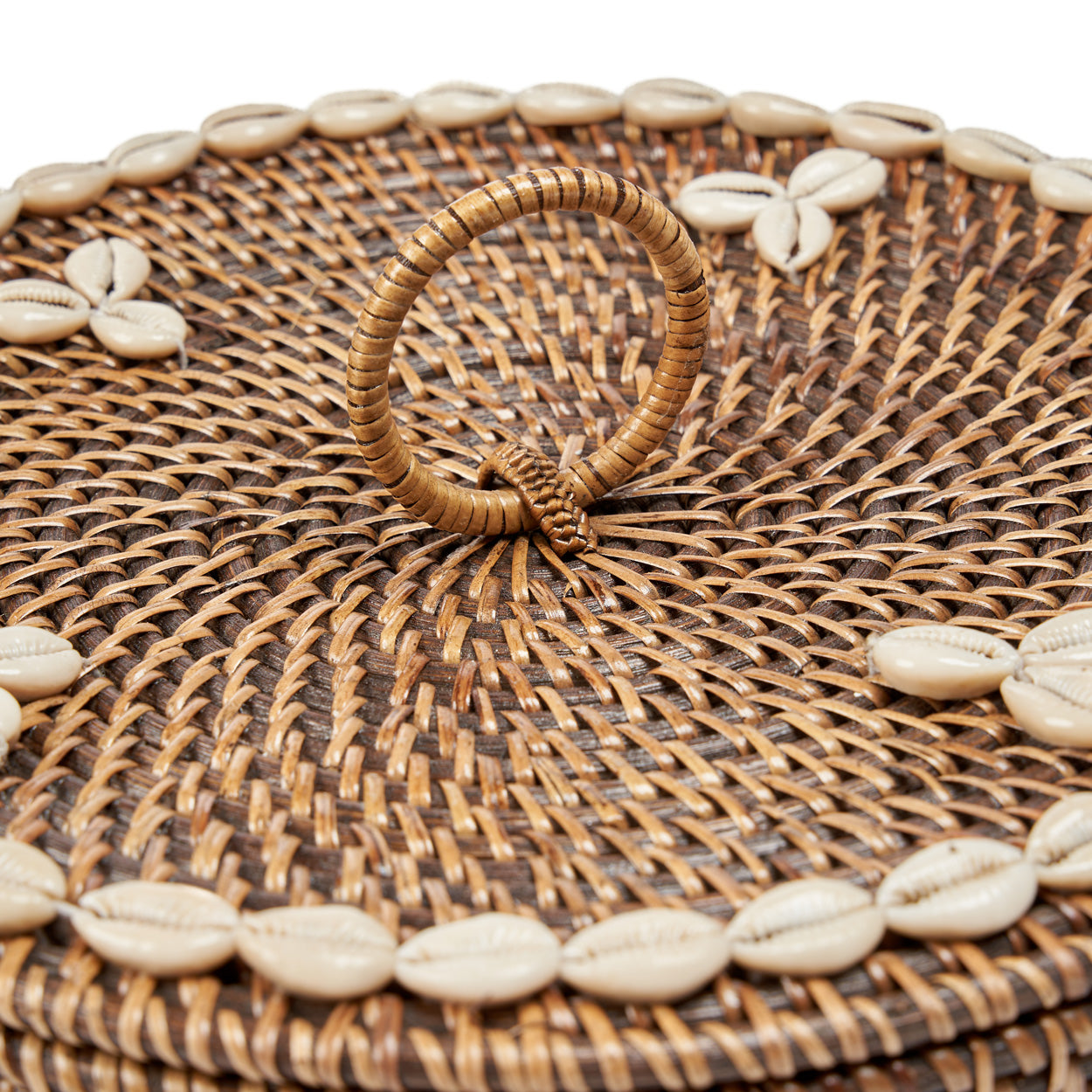The Rattan Compartment Basket open with lid leaning against it showing the four compartments and cowrie shell lid