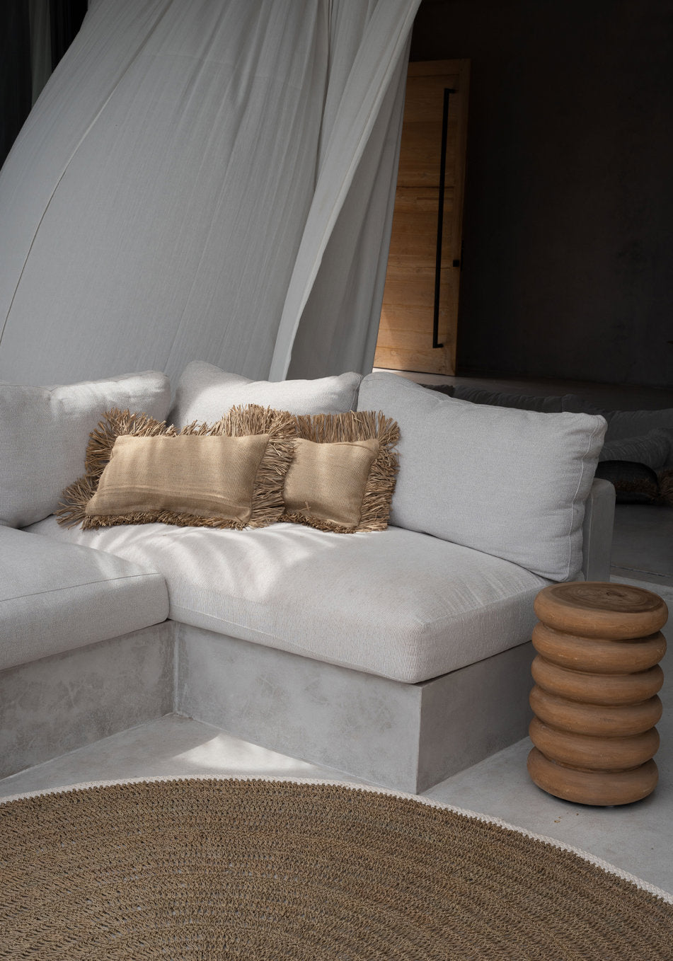Side view of the Jute Bonita Cushion Cover showing fringe and jute weave