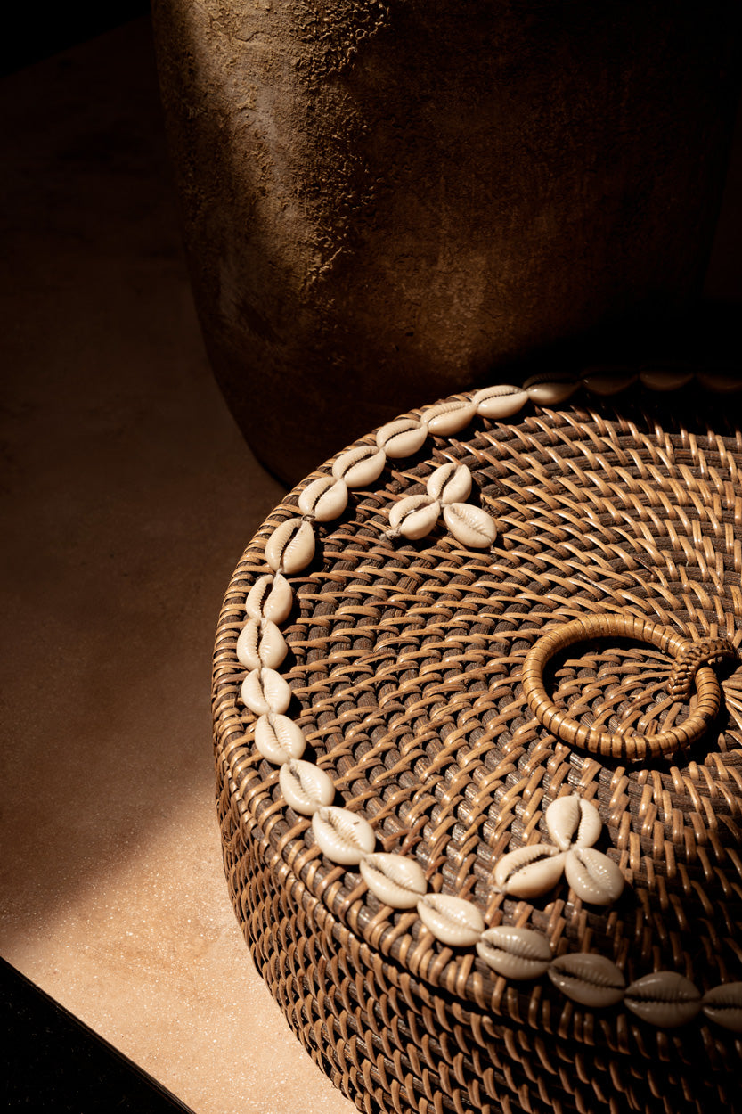 Front view of the Rattan Compartment Basket closed with lid showing the full profile and cowrie shell embellishment