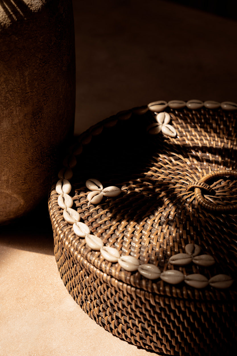 Side detail of the Rattan Compartment Basket showing the herringbone rattan weave on the basket body