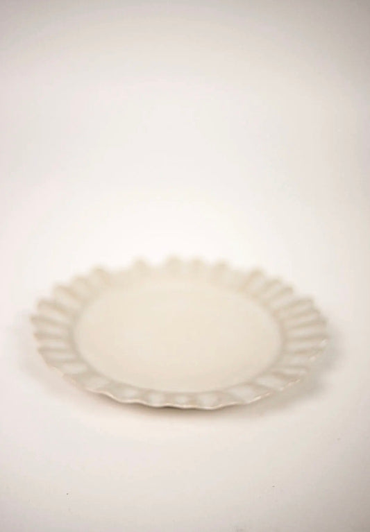 Valerie Dinner Plate White — side view showing wavy edge profile on white background