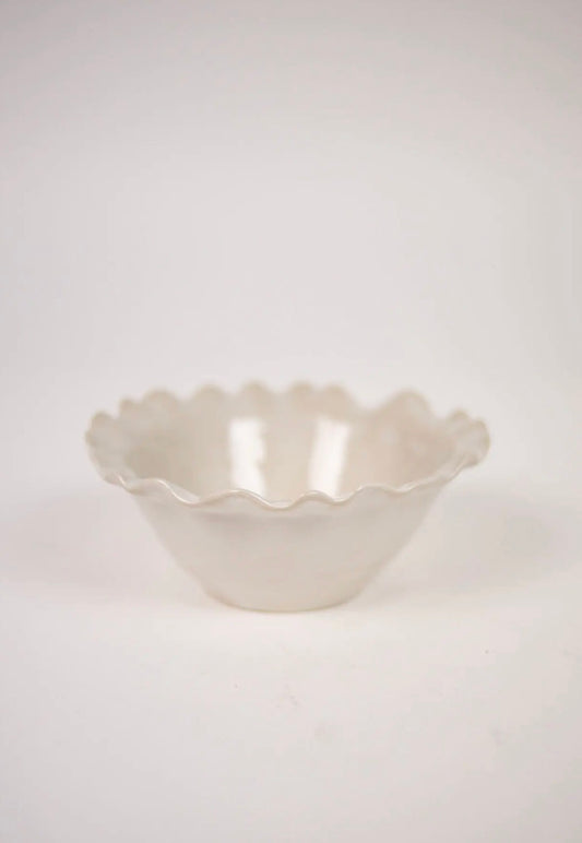 Valerie Bowl White — side view of white stoneware bowl with decorative wavy edge on light grey background