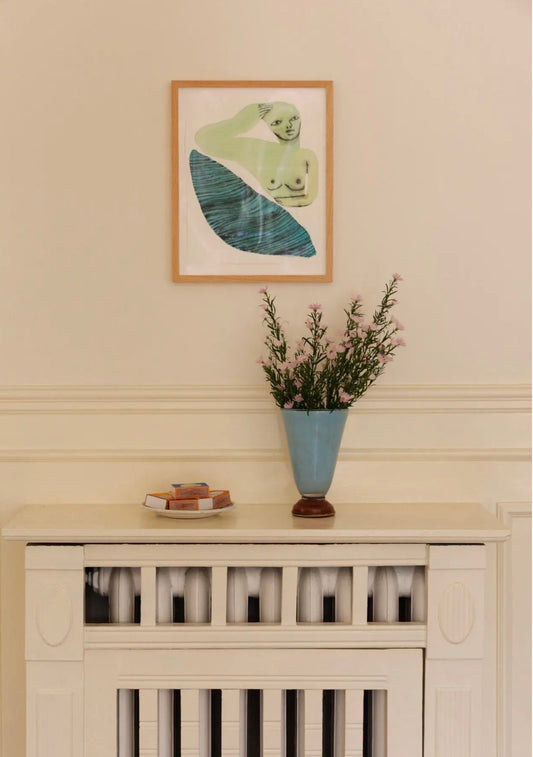 Lolli Vase Small Light Blue — styled on a mantelpiece with dried flowers, framed artwork above