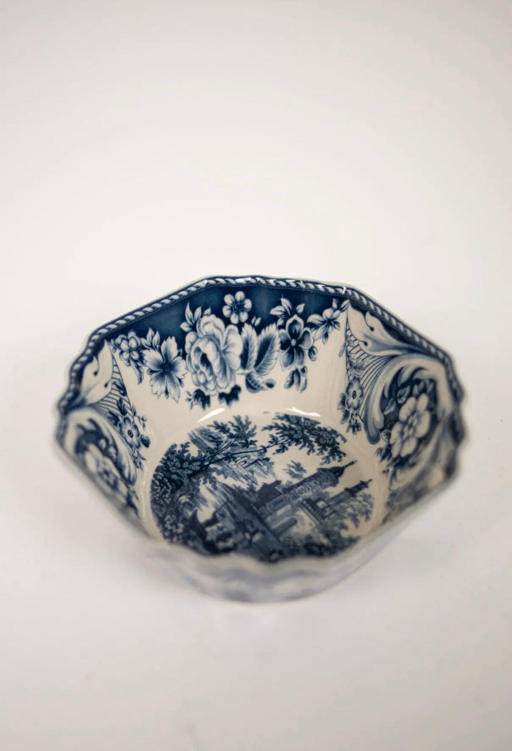 Estelle Bowl Blue — top view of octagonal stoneware bowl with blue toile floral and landscape motif, rope-twist rim on white background