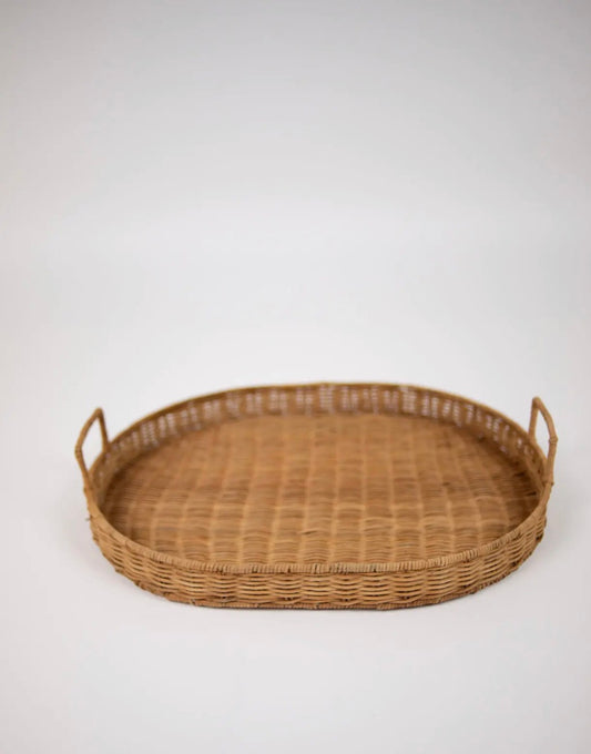 Kate Tray — oval hand-woven rattan tray with two square loop handles, front view on white background