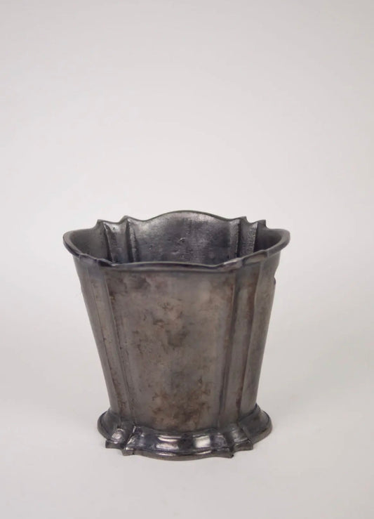 Elara Wine Cooler — aged aluminium fluted wine cooler with scalloped rim and footed base, front view on grey background
