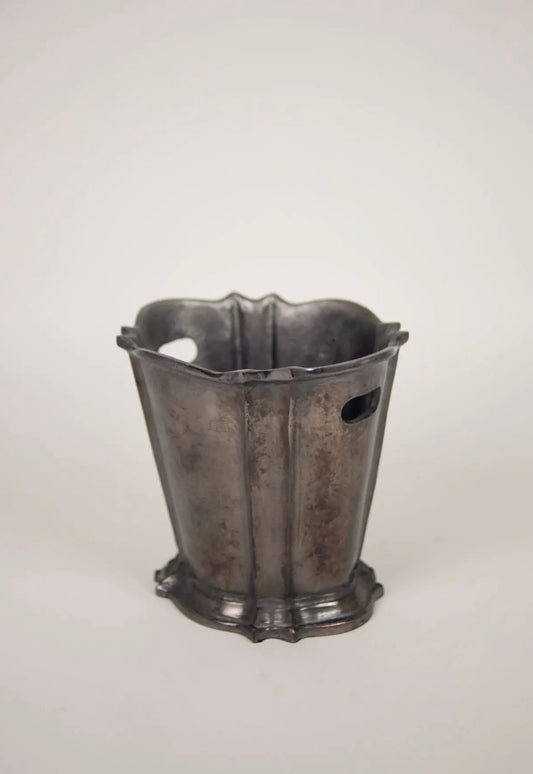 Elara Wine Cooler — angled view showing scalloped rim detail and side drainage holes on grey background