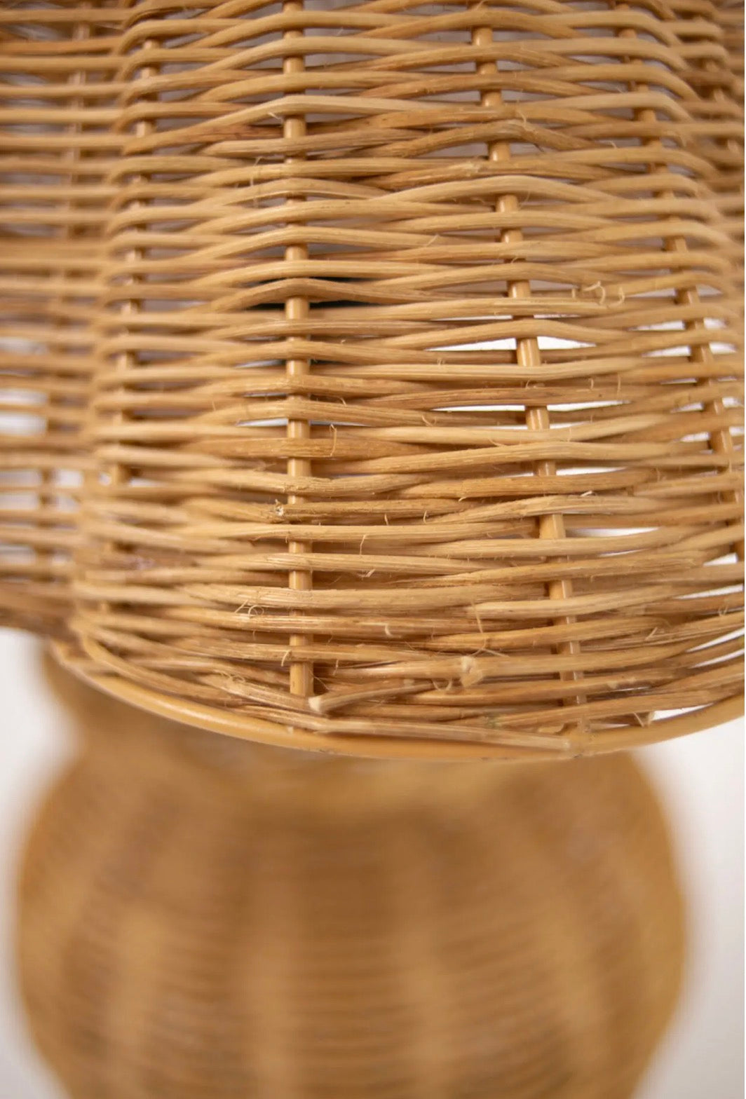 Bani Table Lamp — close-up of open rattan weave detail on conical shade