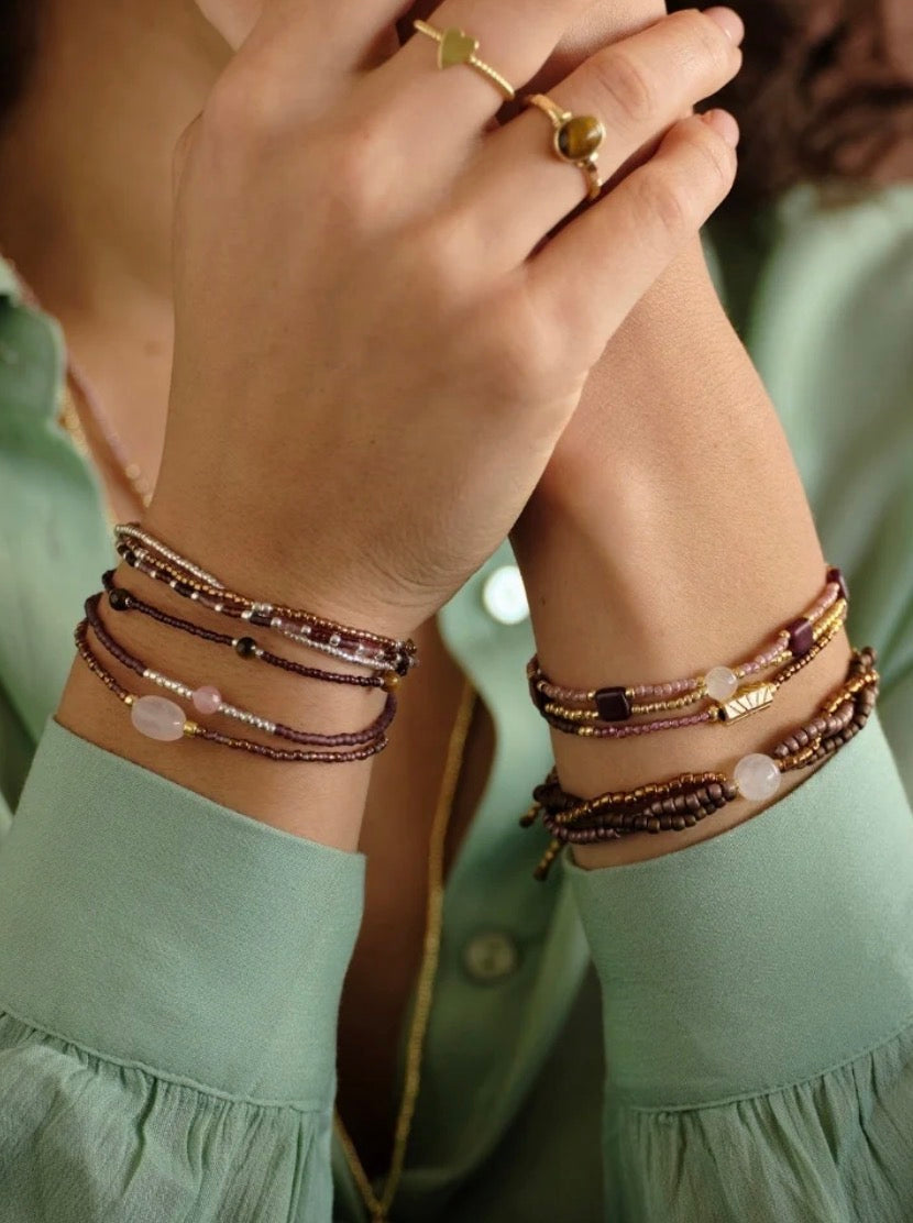 Unwritten Rose Quartz Bracelet – Model wearing stacked bracelets