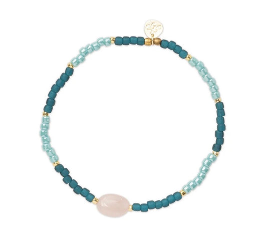 Haze Rose Quartz Bracelet – Teal beaded bracelet with rose quartz on white background