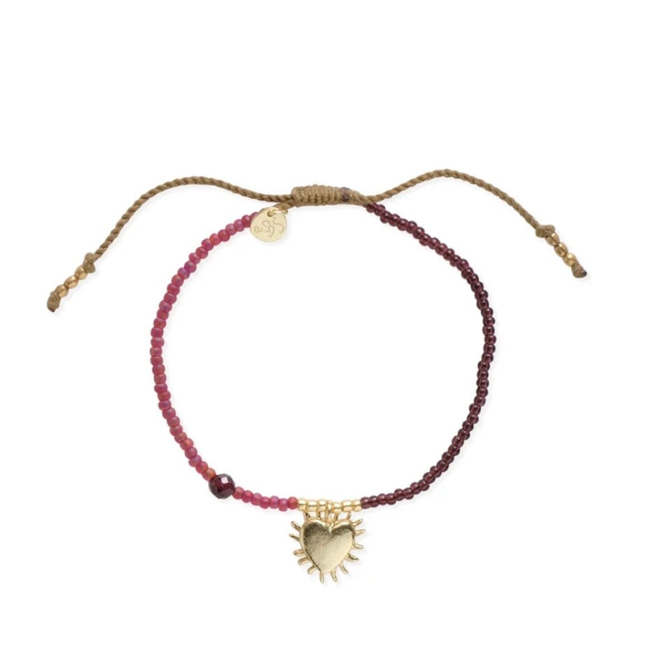 Hoping Garnet Bracelet – Pink beaded bracelet with gold flaming heart pendant on white background