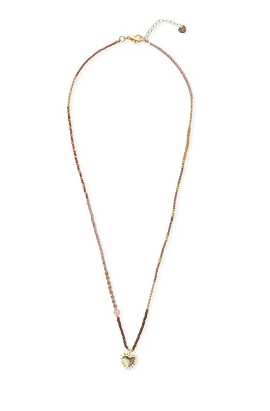 Adventurous Rose Quartz Necklace – Beaded necklace with flaming heart pendant on white background